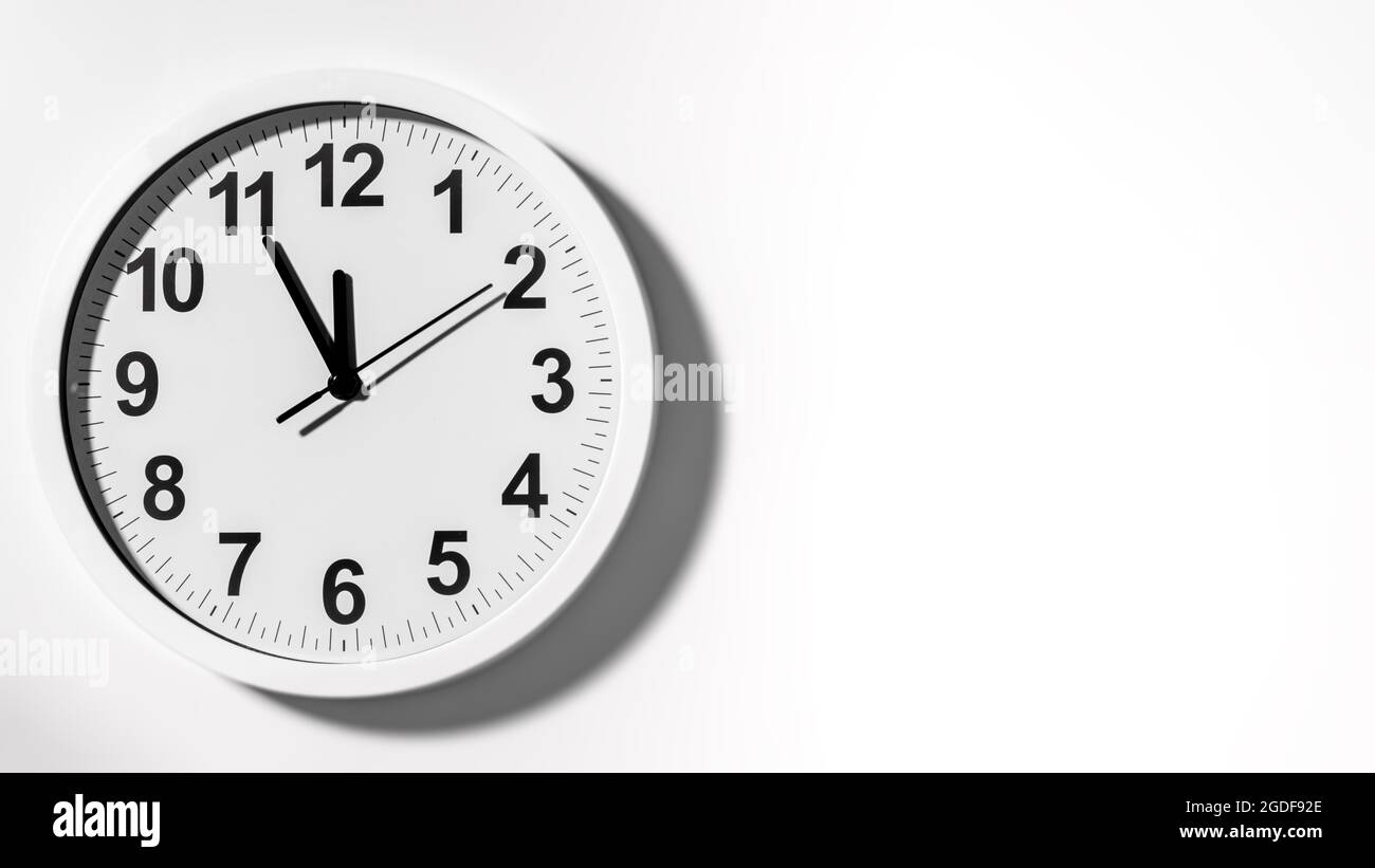 It is five to twelve, the clock is ticking. White Watch shows the time