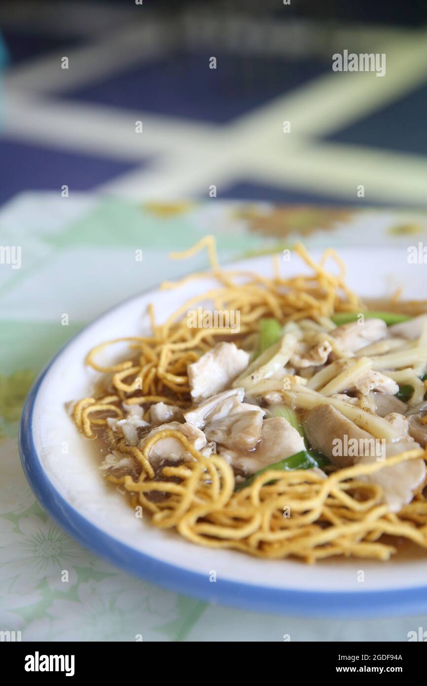 Crispy Noodles with Gravy Stock Photo Alamy