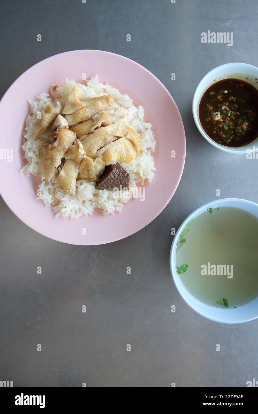 Thai food gourmet steamed chicken with rice , khao mun kai in wood background Stock Photo