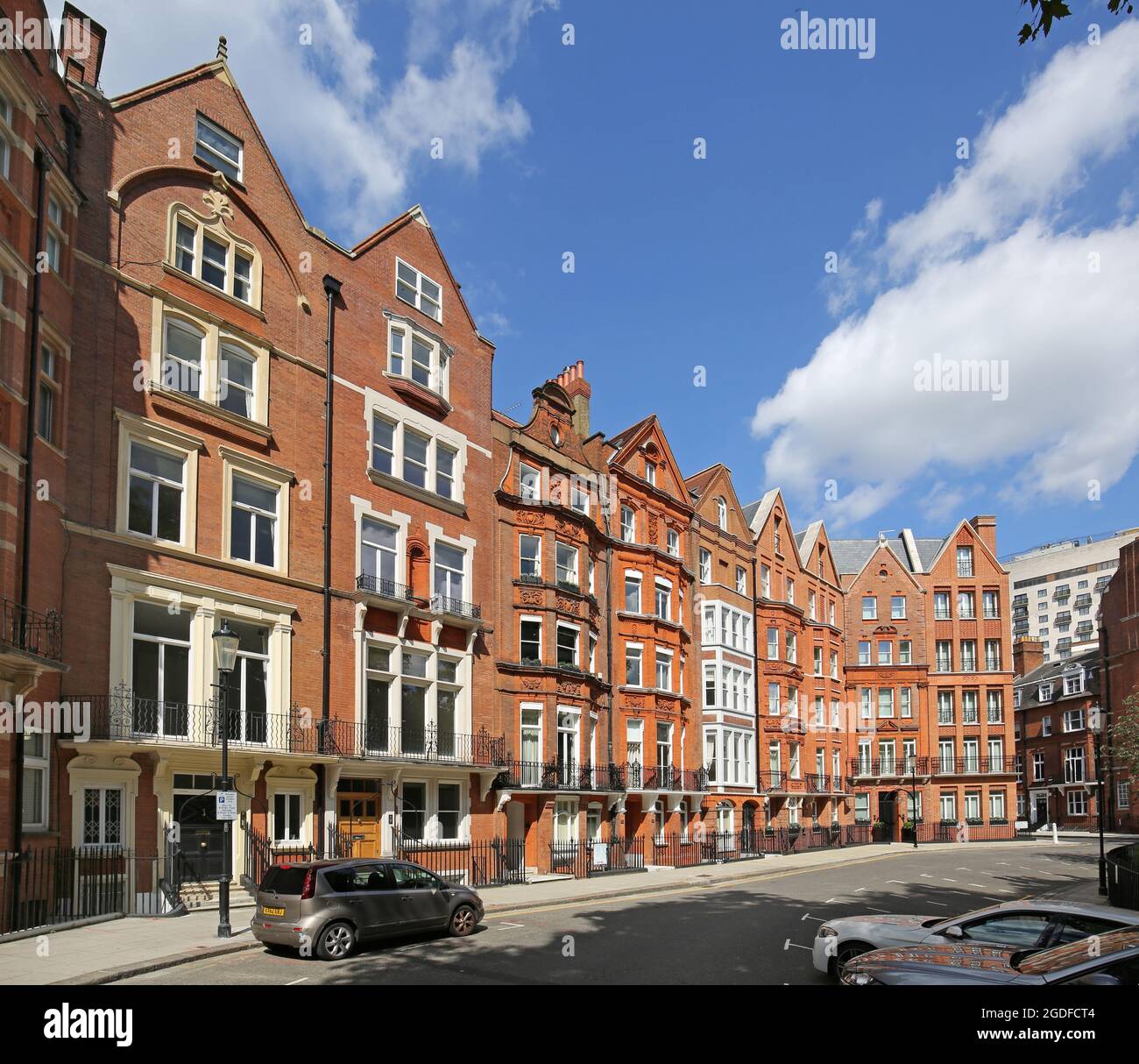 Houses on the east side of Hans Place, an ornate garden square in Chelsea, London, UK. Highly sought after, home to the super-rich Stock Photo