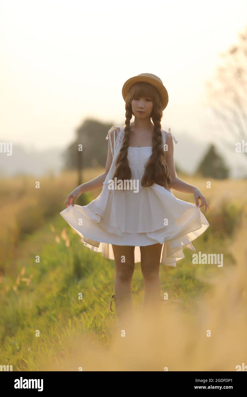 Asian girl on wheat Stock Photo