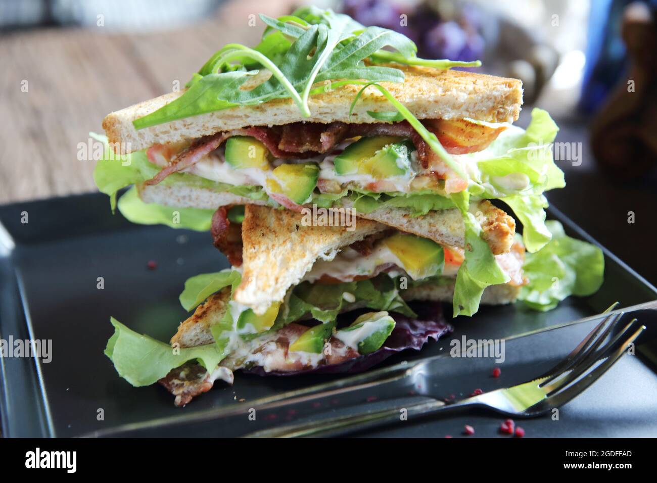 Sandwiches with meet and vegetables on wood background Stock Photo