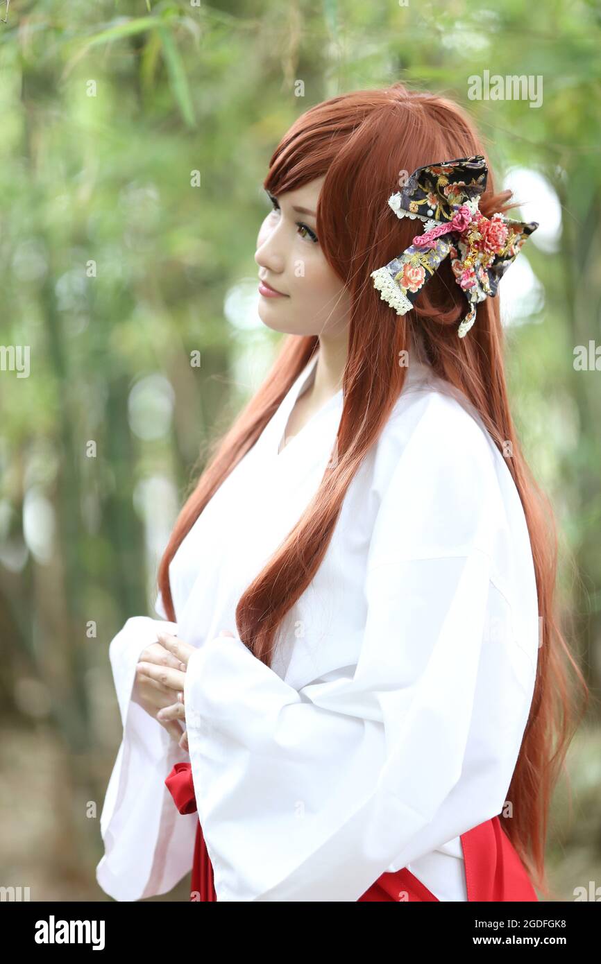 Asian girl portrait , Japanese Miko in nature Stock Photo