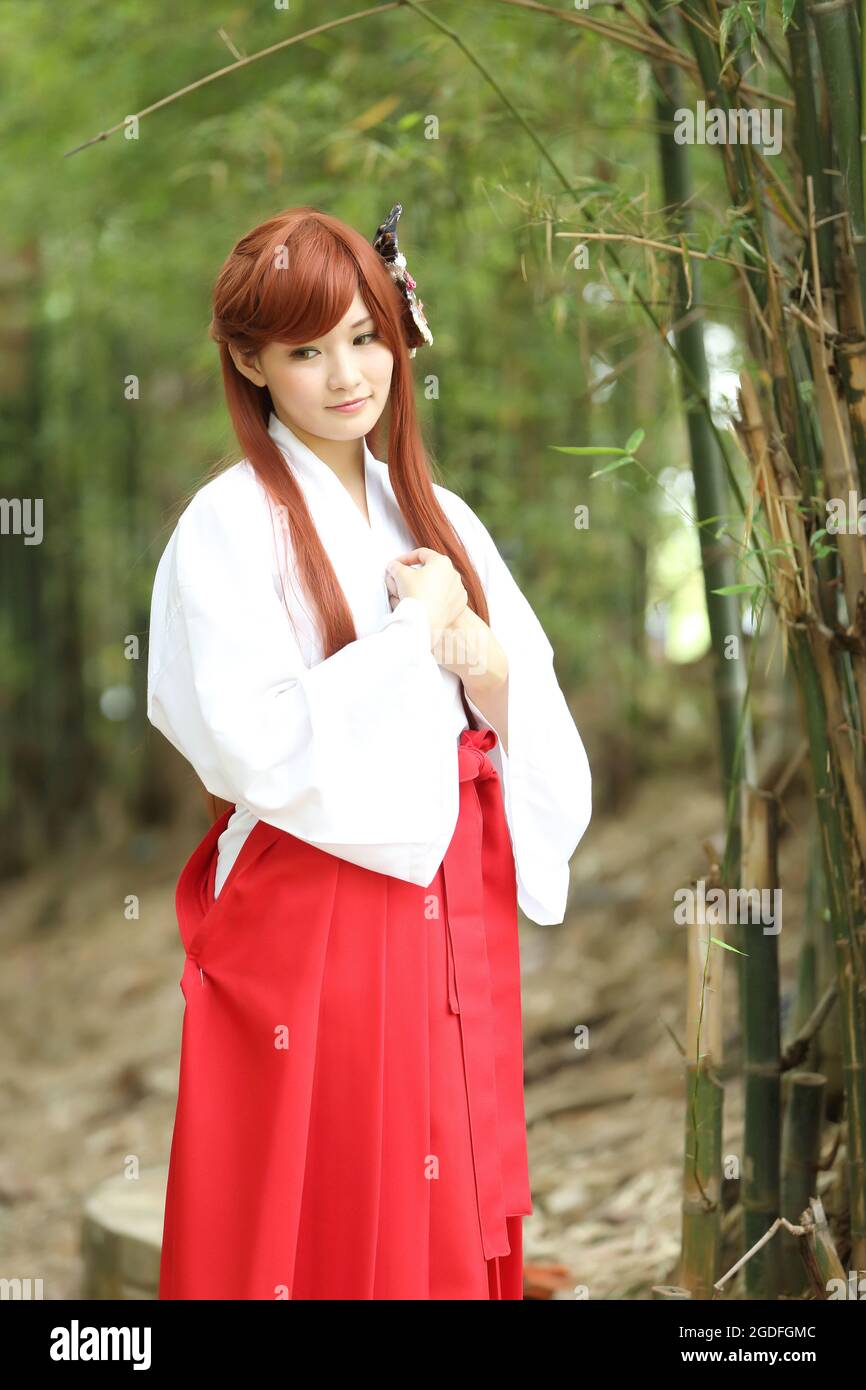 Asian girl portrait , Japanese Miko in nature Stock Photo