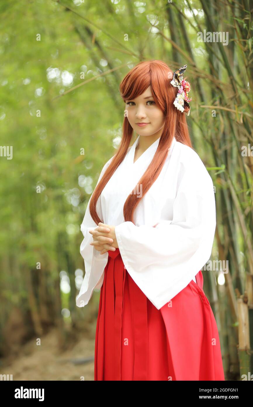 Asian girl portrait , Japanese Miko in nature Stock Photo