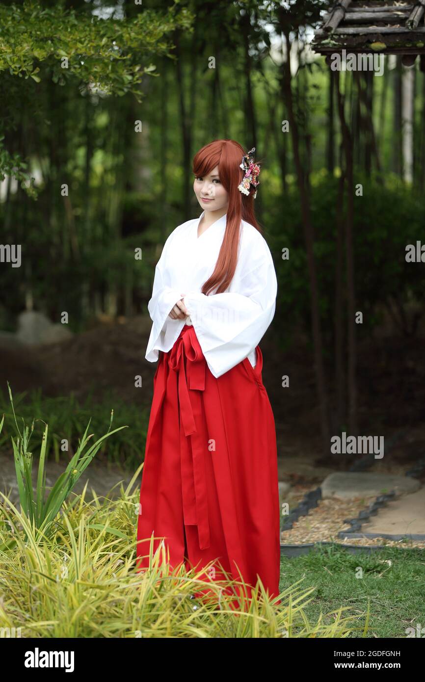 Asian girl portrait , Japanese Miko in nature Stock Photo