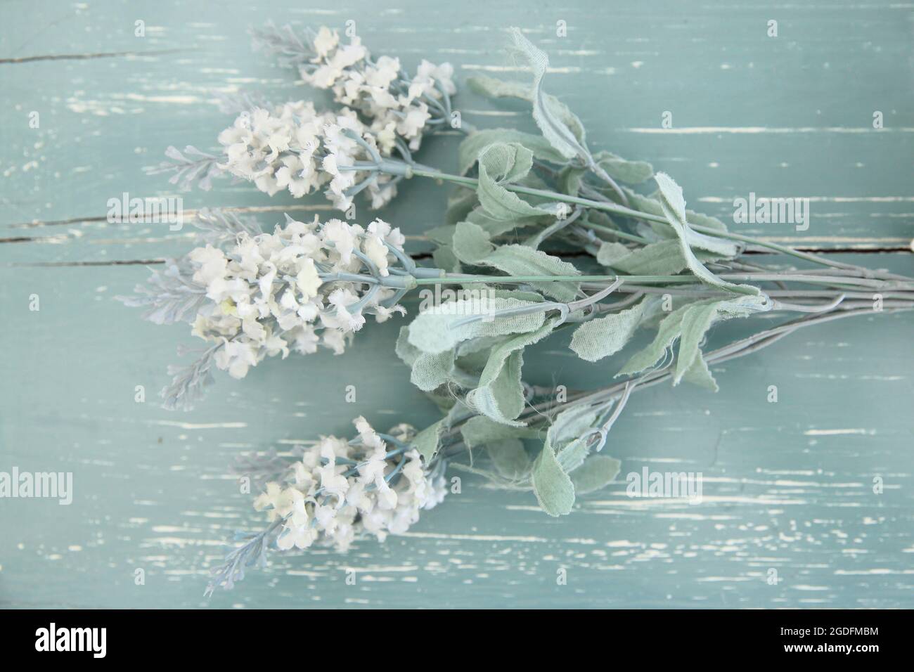 Flowers on vintage wood background Stock Photo - Alamy