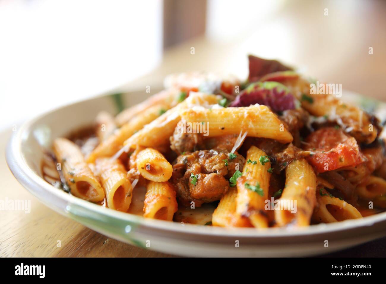 Penne pasta in tomato sauce with meatballs Stock Photo - Alamy