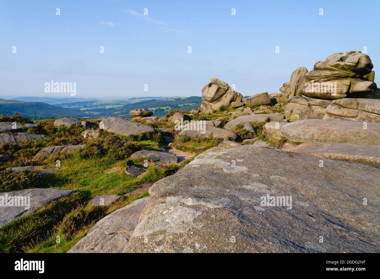 High on a hill in the Peak District gritstone boulders and outcrops ...