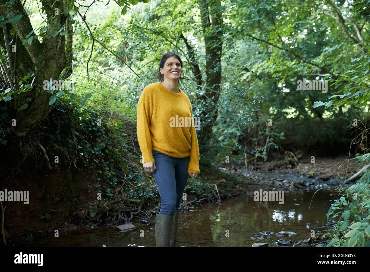 Hiker standing by tree hi-res stock photography and images - Alamy