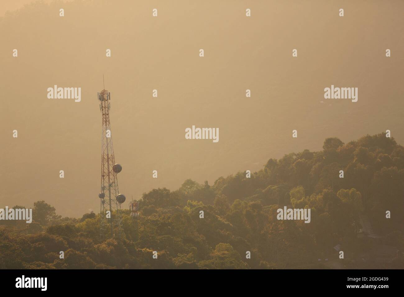 Phone antenna on moutain with sunrise Stock Photo