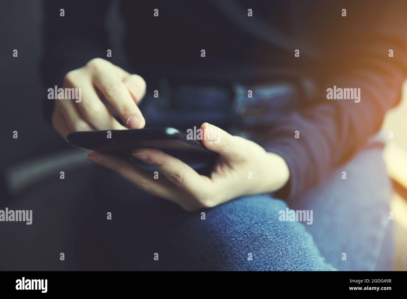 Asian female with hands typing text message Stock Photo - Alamy