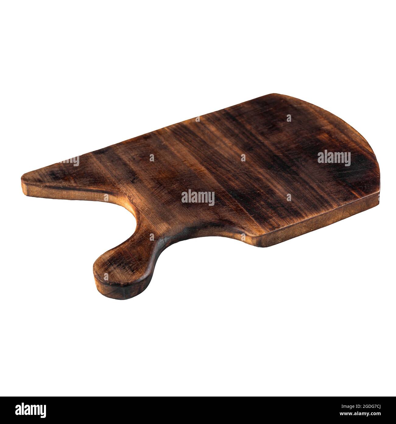 Isolated unusual shape dark wooden cutting board Stock Photo