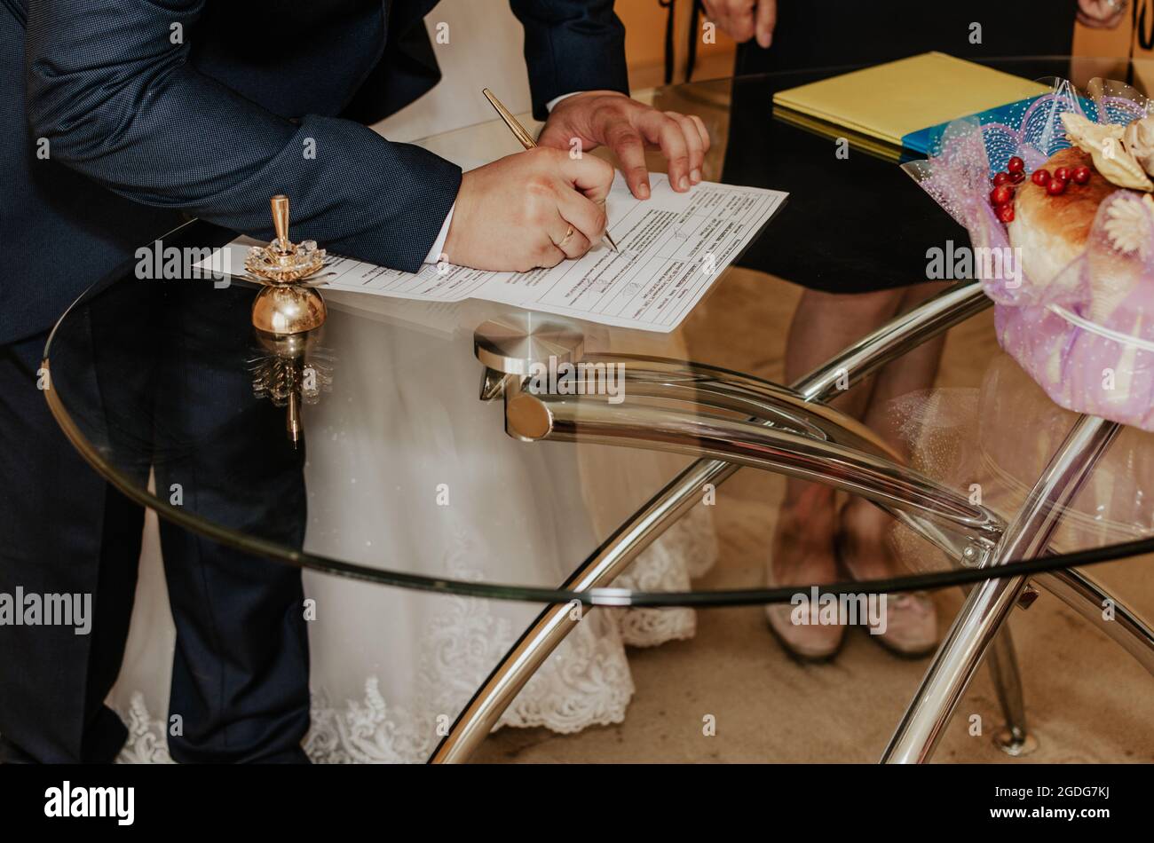 human hand with writing pen.official wedding ceremony in registry