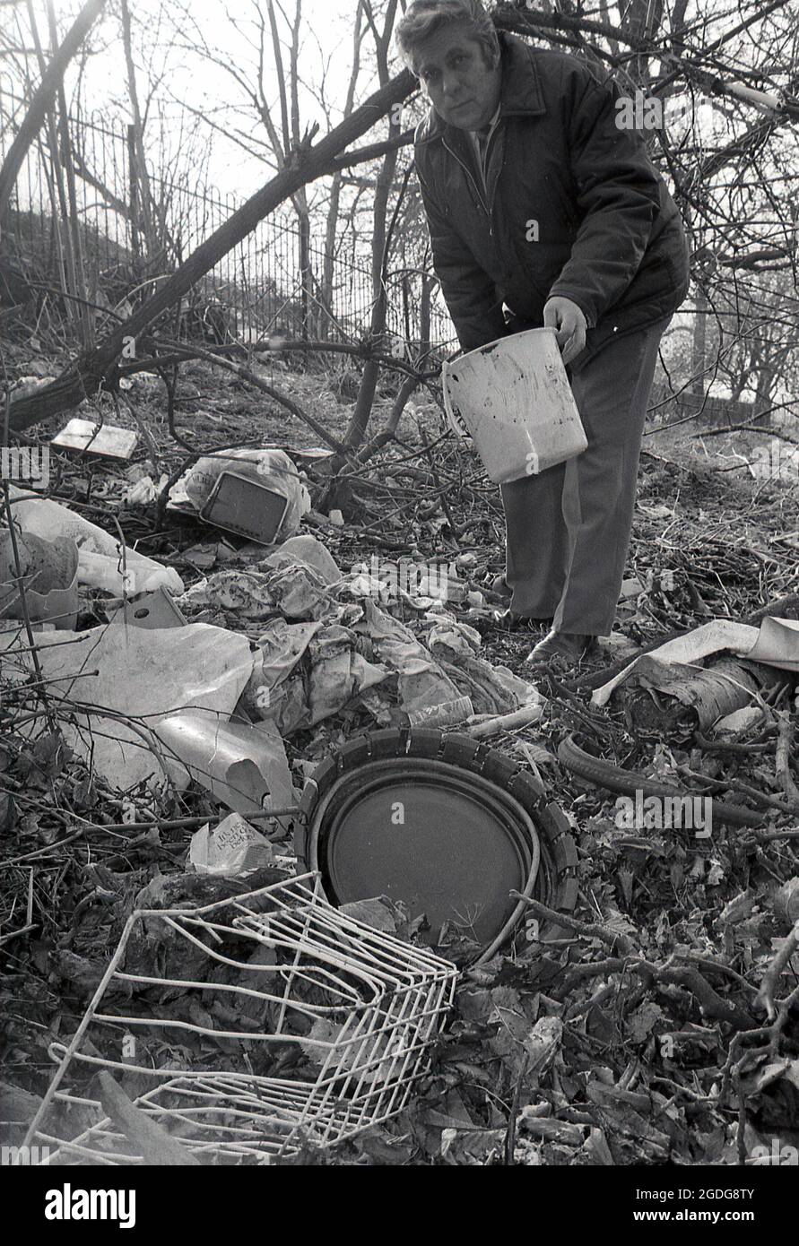 1987, historical, a man showing the rubbish left or dumped on an