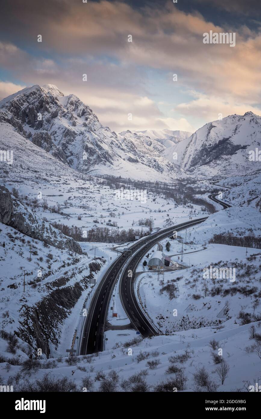 snowy curves on high mountain highway Stock Photo