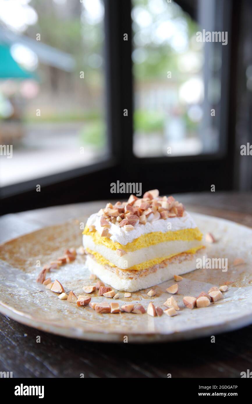 Mango cake with bean on wood background Stock Photo