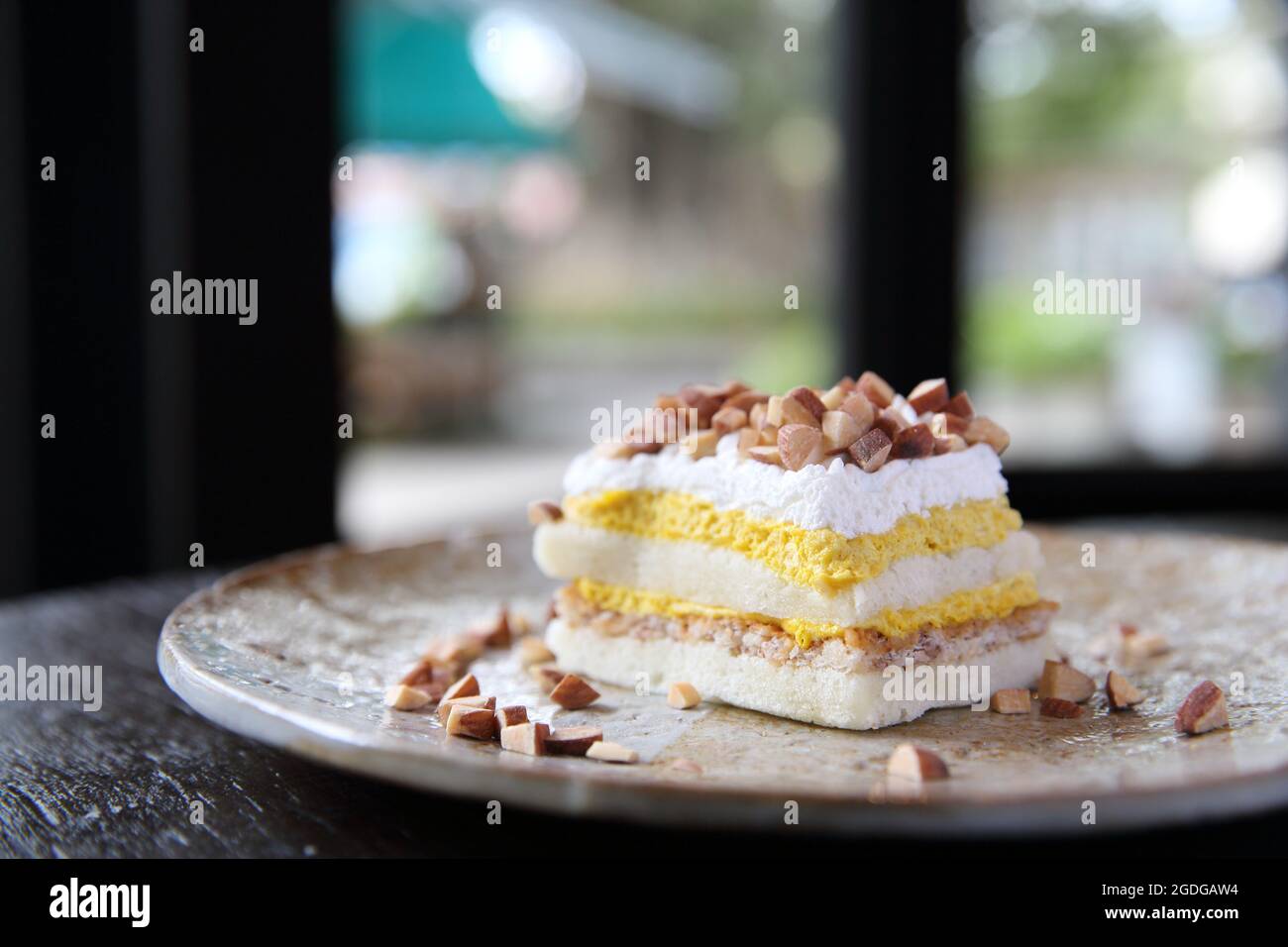 Mango cake with bean on wood background Stock Photo
