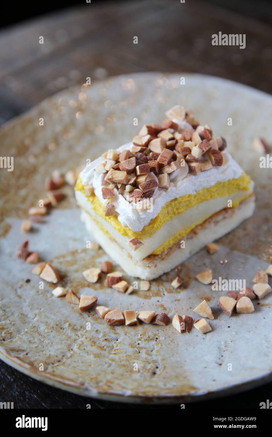 Mango cake with bean on wood background Stock Photo