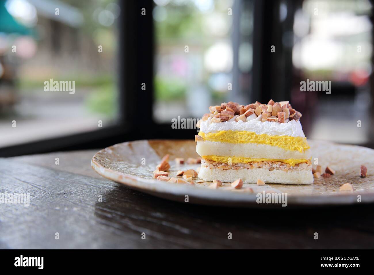 Mango cake with bean on wood background Stock Photo