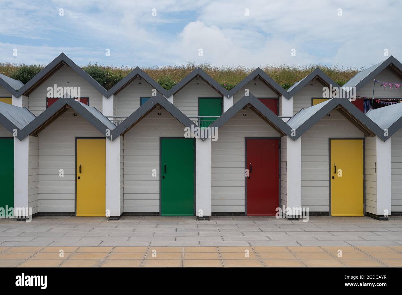 Colourful new beach huts at Swanage Stock Photo