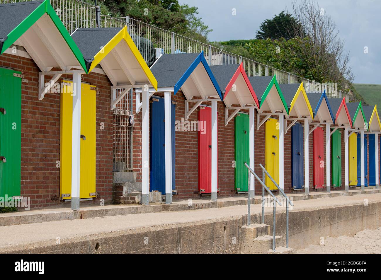 Colourful beach huts on swanage beach Stock Photo
