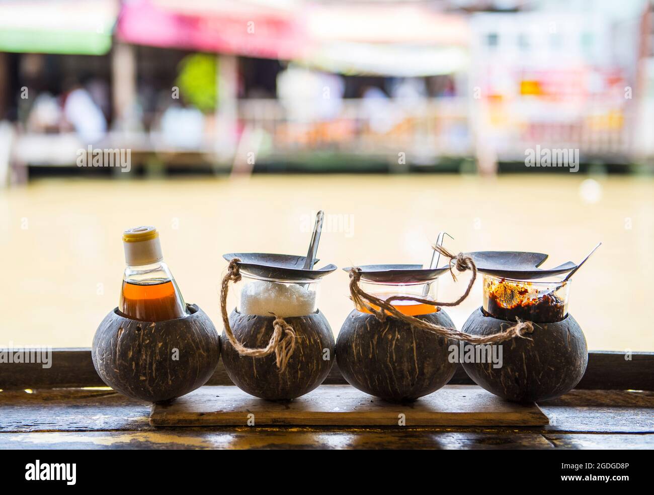 Traditional Thai condiments at outdoor restaurant Stock Photo