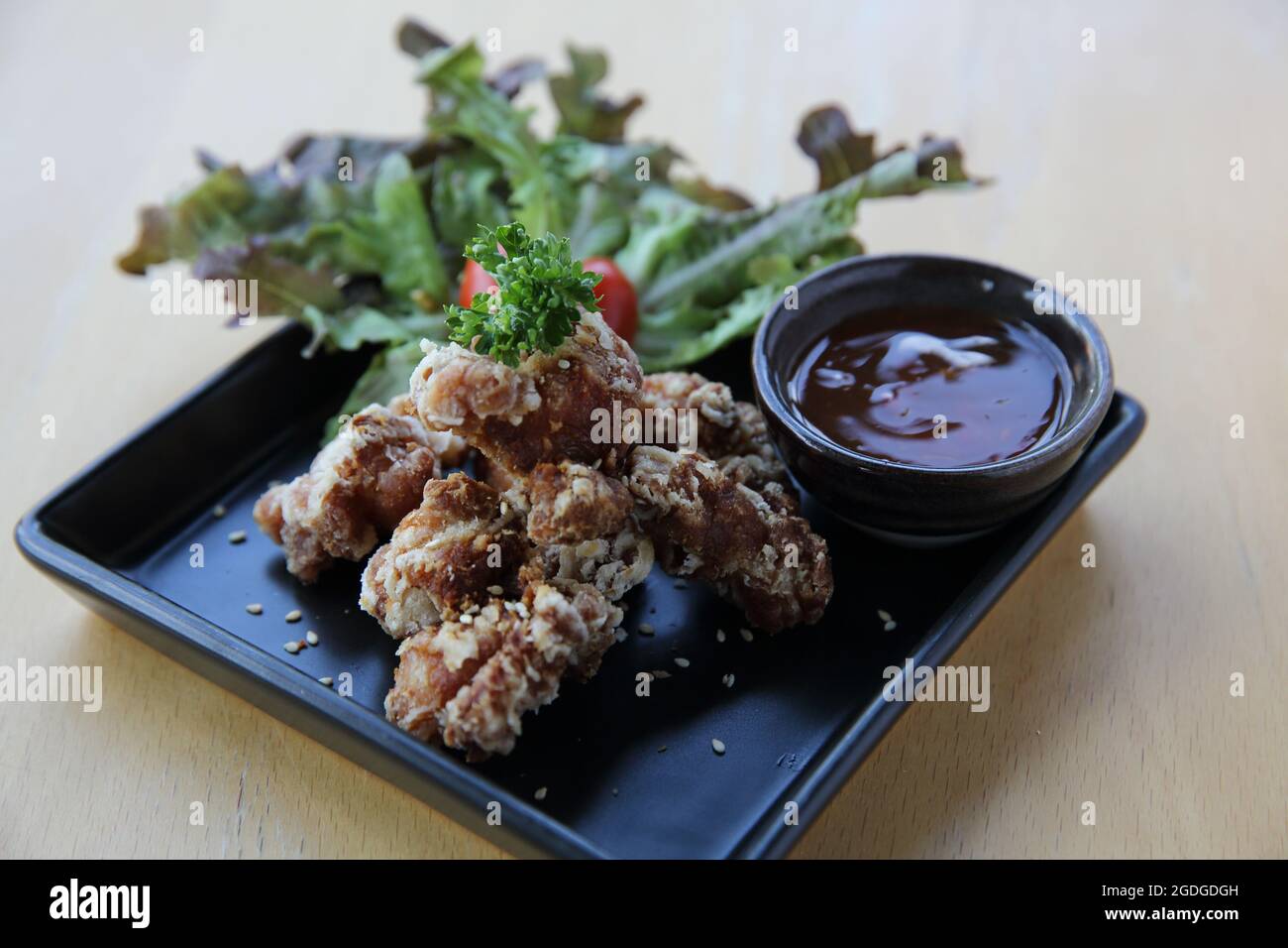 chicken karaage japanese fried chicken on wood background Stock Photo