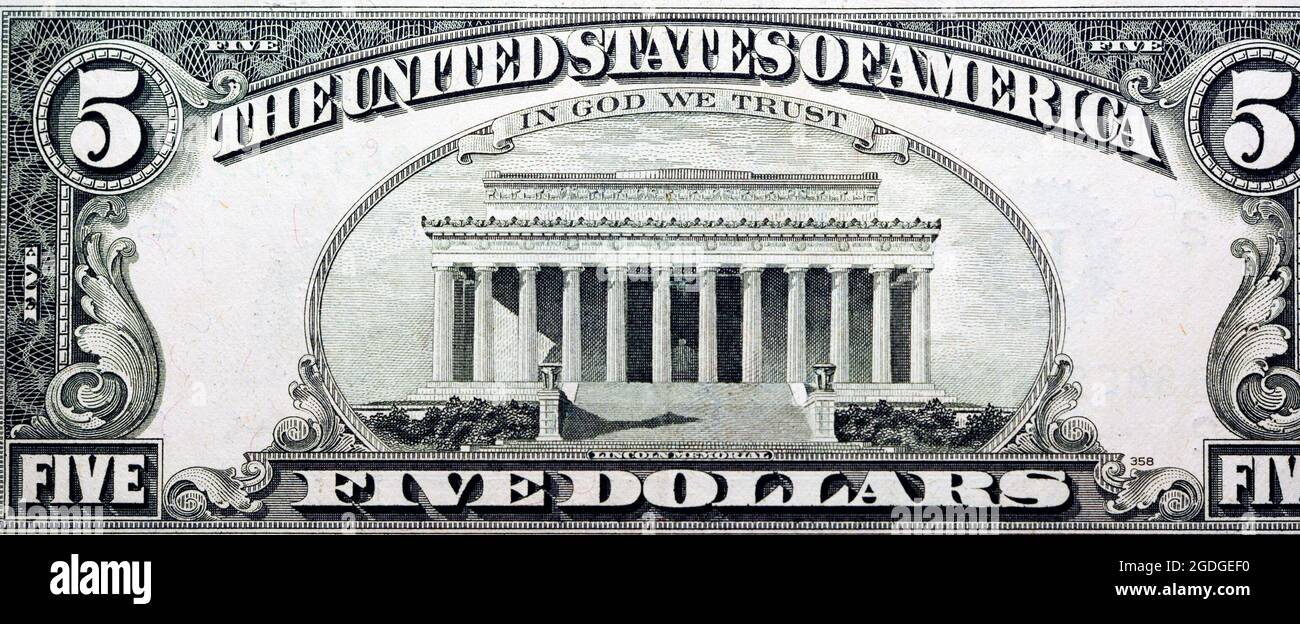 Image of the Lincoln Memorial and the inscription In God we trust, USA. reverse of 5 five dollars US bill series 1988, Old American money, vintage Stock Photo