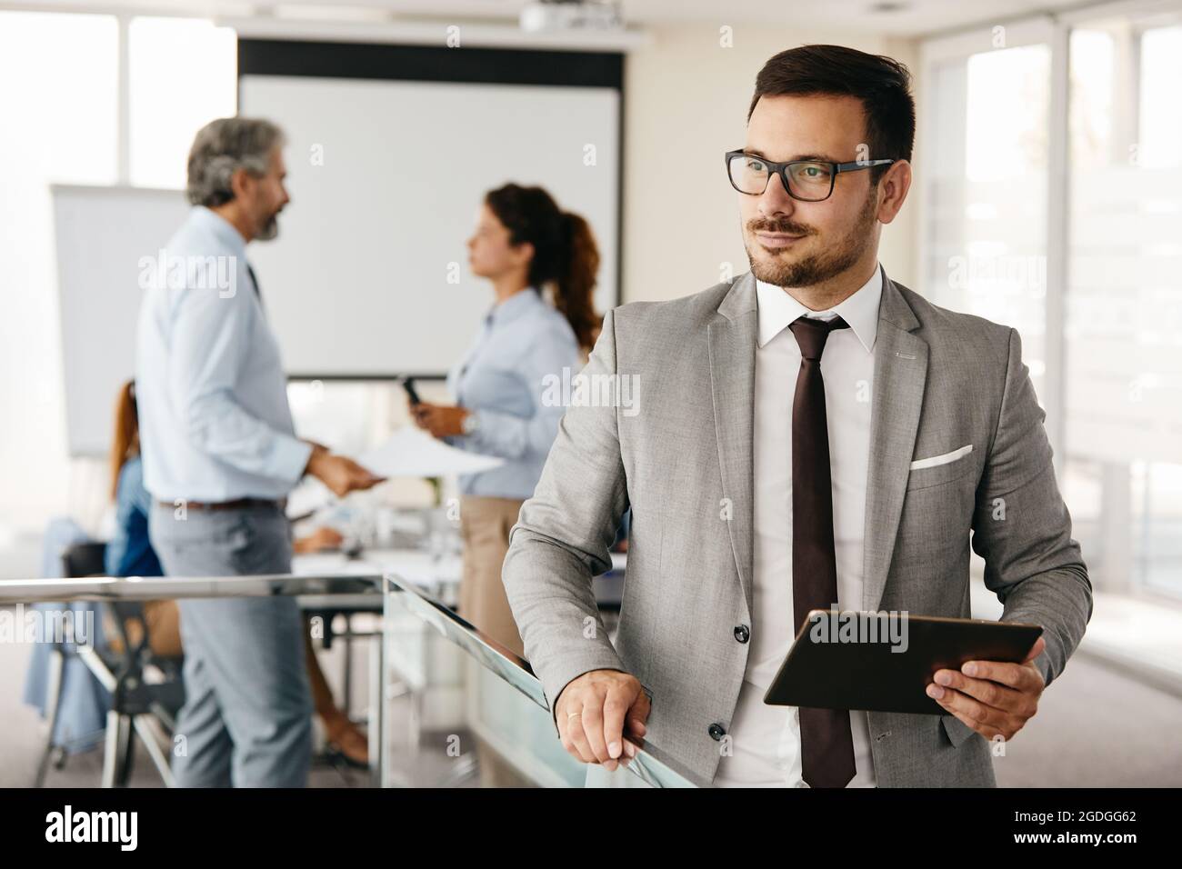 businessman office portrait corporate meeting tablet Stock Photo
