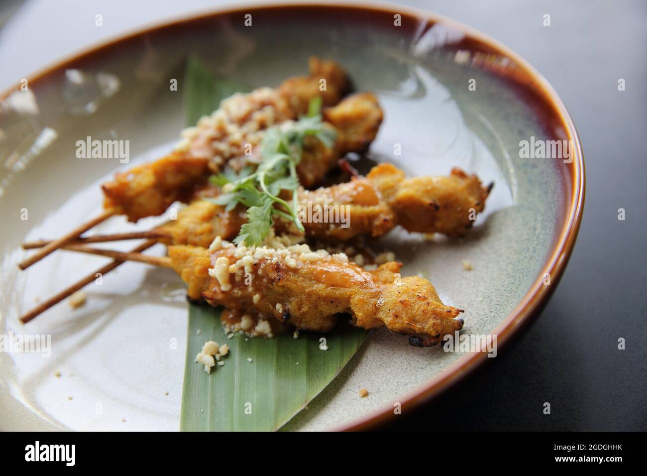 chicken satay, sate ayam and lontong with peanut sauce Stock Photo Alamy