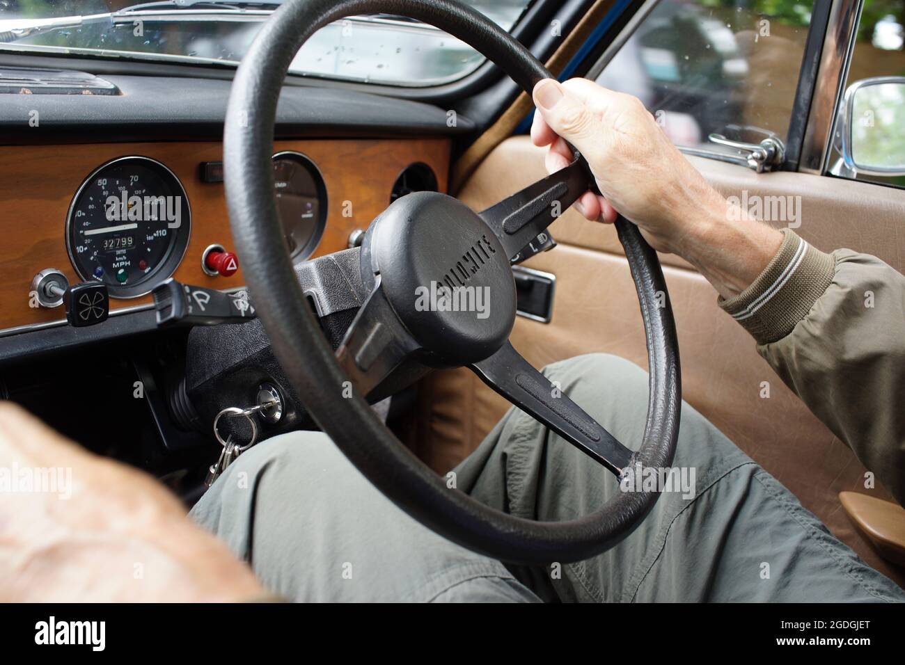 Triumph Dolomite - mans hands on the steering wheel, driving Stock Photo