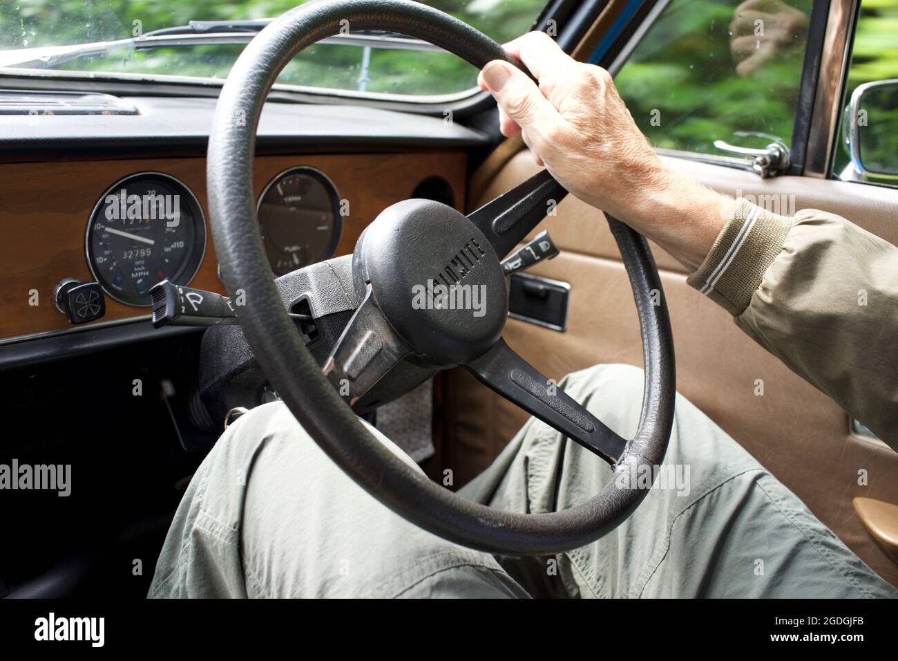 Triumph Dolomite - at the steering wheel, man driving, on the road Stock Photo