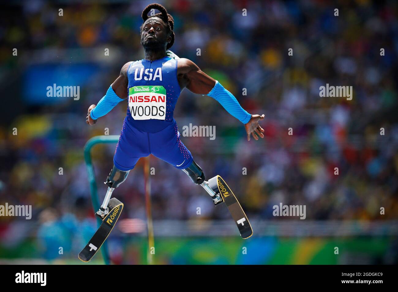 Regas Woods of USA Paralympic Games team long jump T42. Running amputee sprinter competes with prosthetic running blades Stock Photo