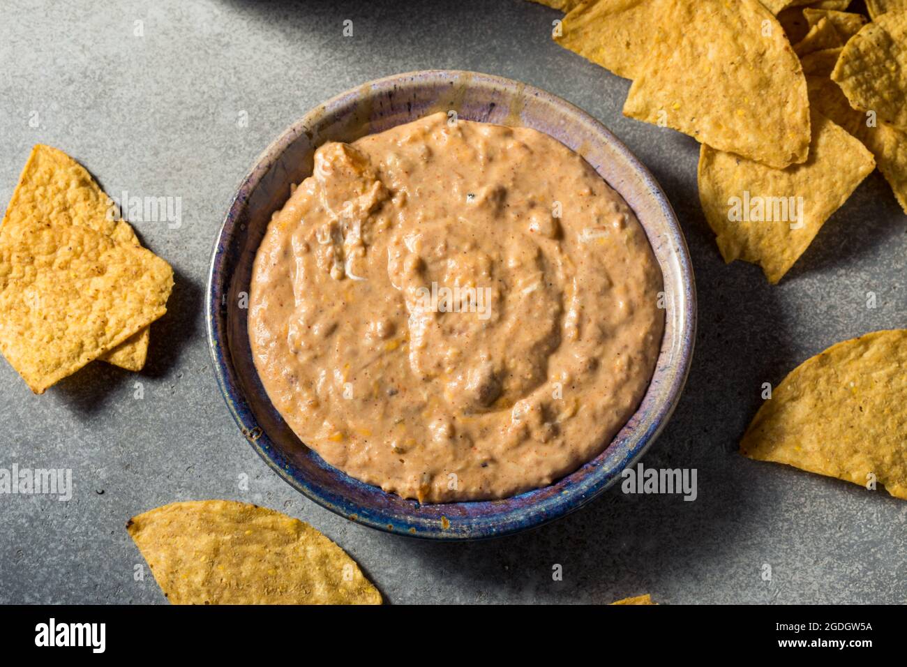 Homemade Refried Baked Bean Dip with Cheese and Chips Stock Photo Alamy