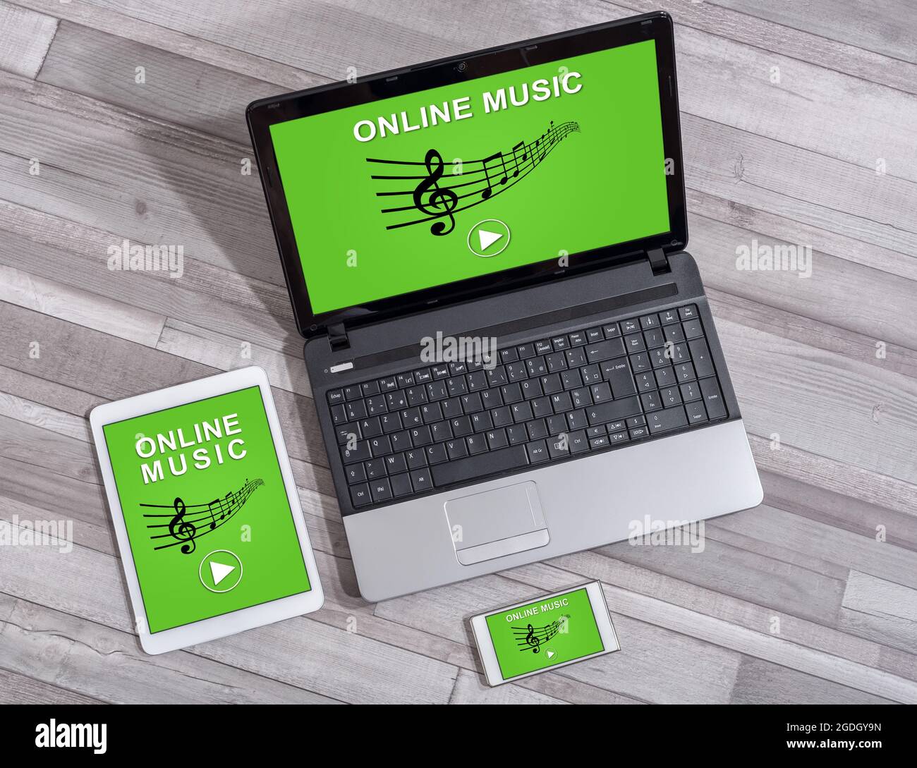 Online music concept shown on different information technology devices Stock Photo