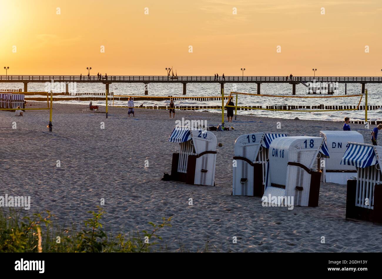 Kuehlungsborn, Germany, Baltic Sea coast: evening atmosphere and sunset at the beach and pier Stock Photo