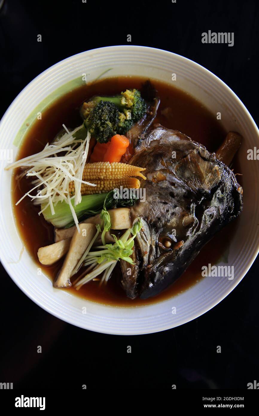 Fish Bolied Japanese food bolied head fish with sauce Stock Photo - Alamy