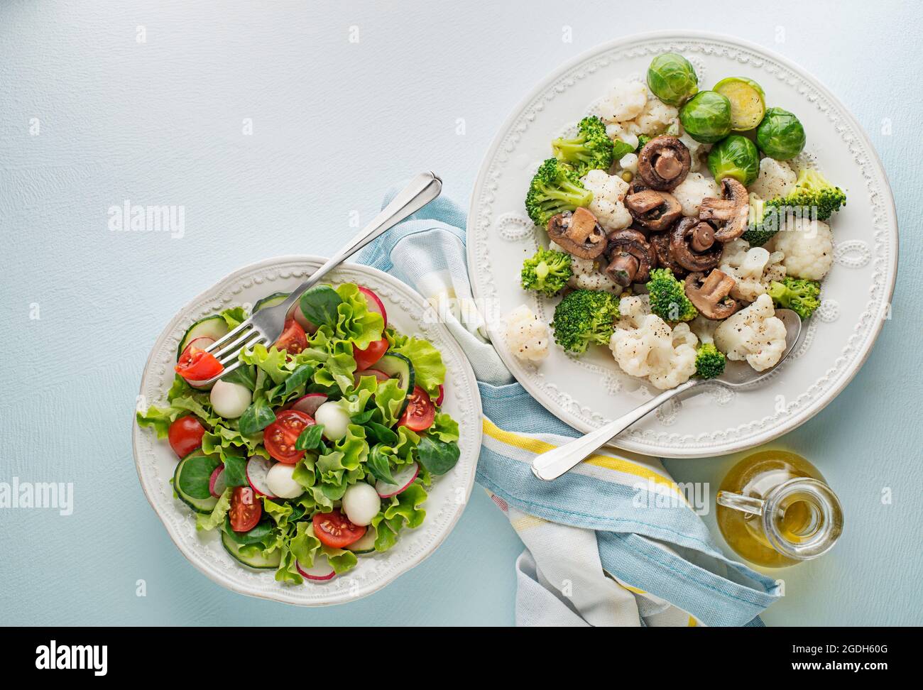Healthy salad meals with cooked vegetable and fresh lettuce salad. Healthy vegetable diet meal. Stock Photo