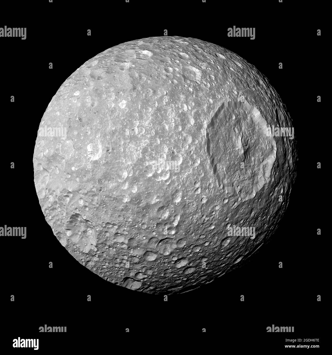 Saturn's moon Mimas as seen by NASA's Cassini. The large crater is the Herschel Crater Stock Photo