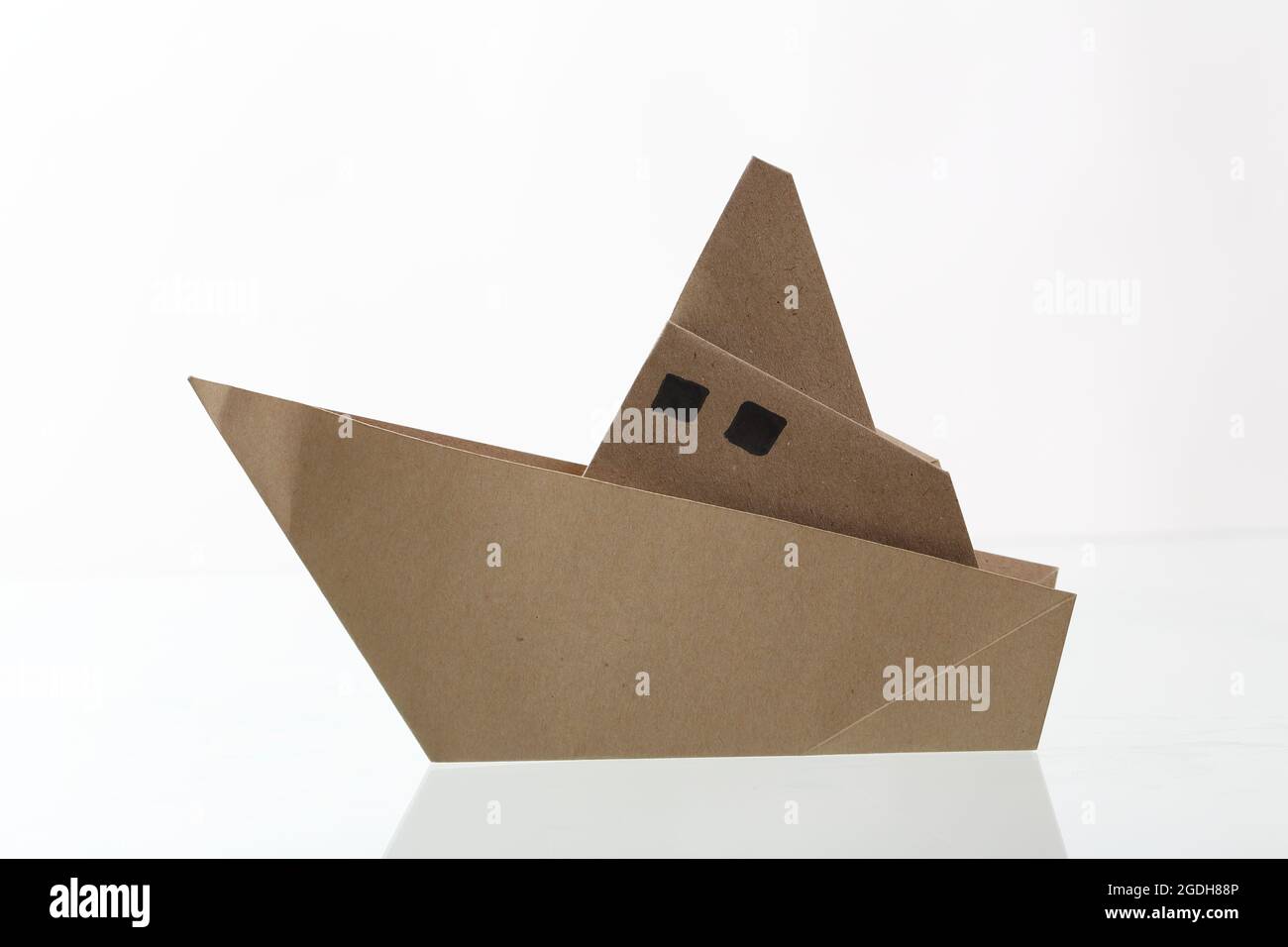 Origami boat papercraft by recycle paper isolated in white background