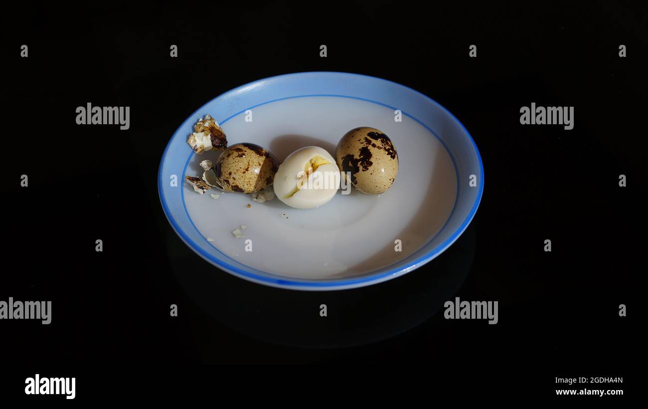 Boiled quail eggs on the plate Stock Photo