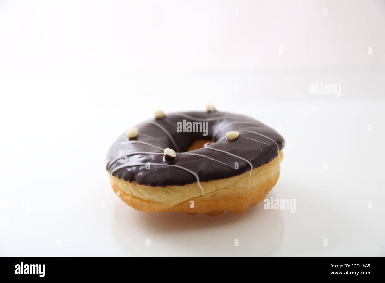 Chocolate donut isolated in white background Stock Photo - Alamy