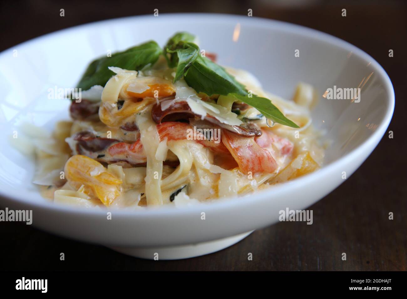 Chorizo sausage spaghetti fettuccine on wood background Stock Photo Alamy