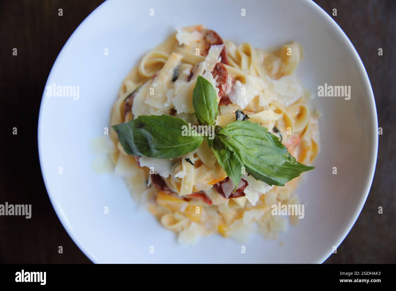 Chorizo sausage spaghetti fettuccine on wood background Stock Photo Alamy