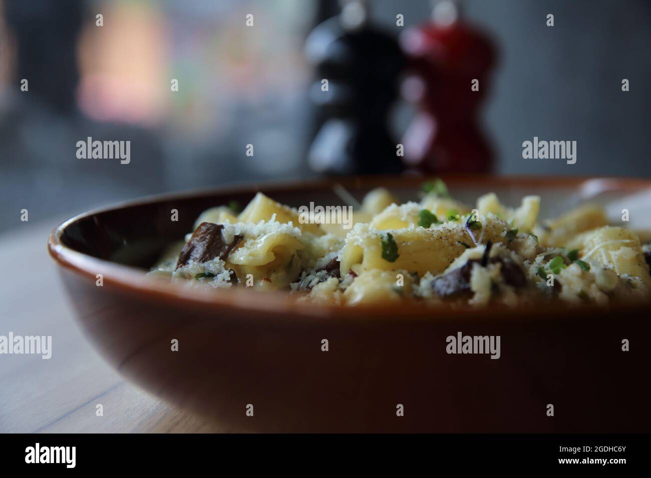pasta mushroom truffle oil on wood background , Rigatoni pasta noodle