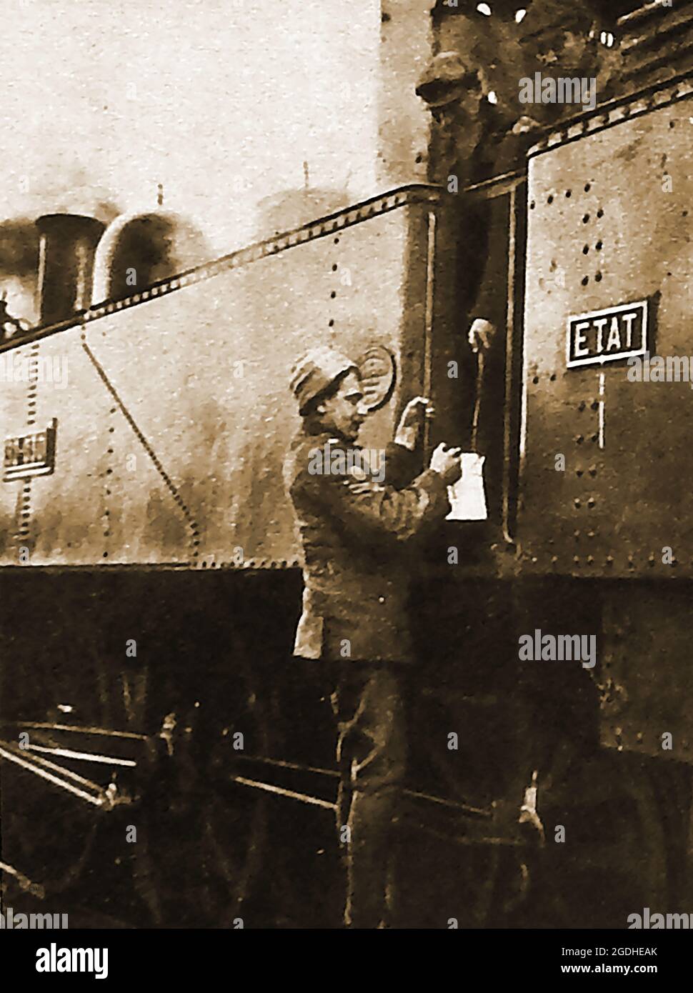 WWI - A British soldier in France drawing  hot water from a railway steam train for shaving, Stock Photo