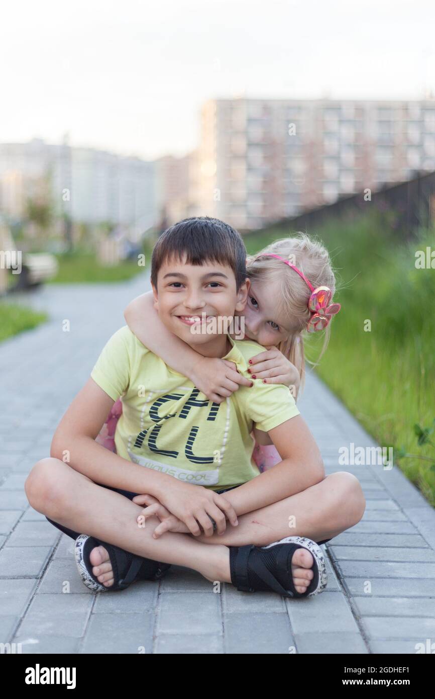 Brother and sister smiling portraits in a summer park Stock Photo - Alamy