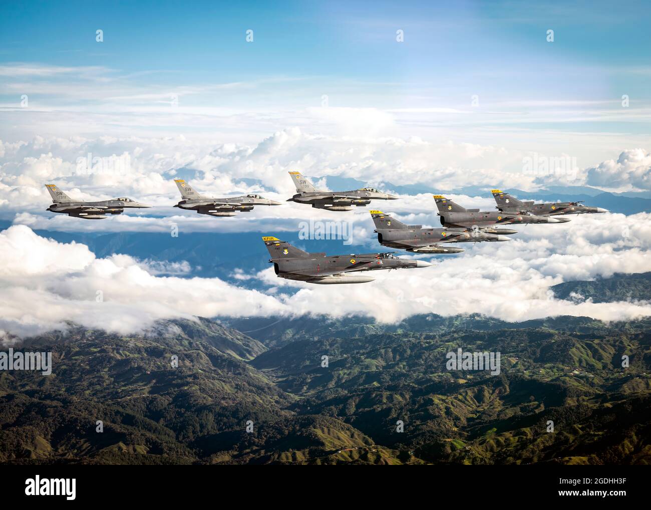 U.S. Air Force F-16 Fighting Falcons assigned to the 79th Expeditionary Fighter Squadron and Colombian Air Force Kfirs fly in formation over Colombia during Exercise Relampago VI, July 27, 2021.  Relampago VI is a combined Colombian and U.S. exercise taking place in the U.S. Southern Command (SOUTHCOM) theater that focuses on techniques, tactics and procedures to strengthen the longstanding partnership between our armed forces. (U.S. Air Force photo by Senior Airman Duncan C. Bevan) Stock Photo