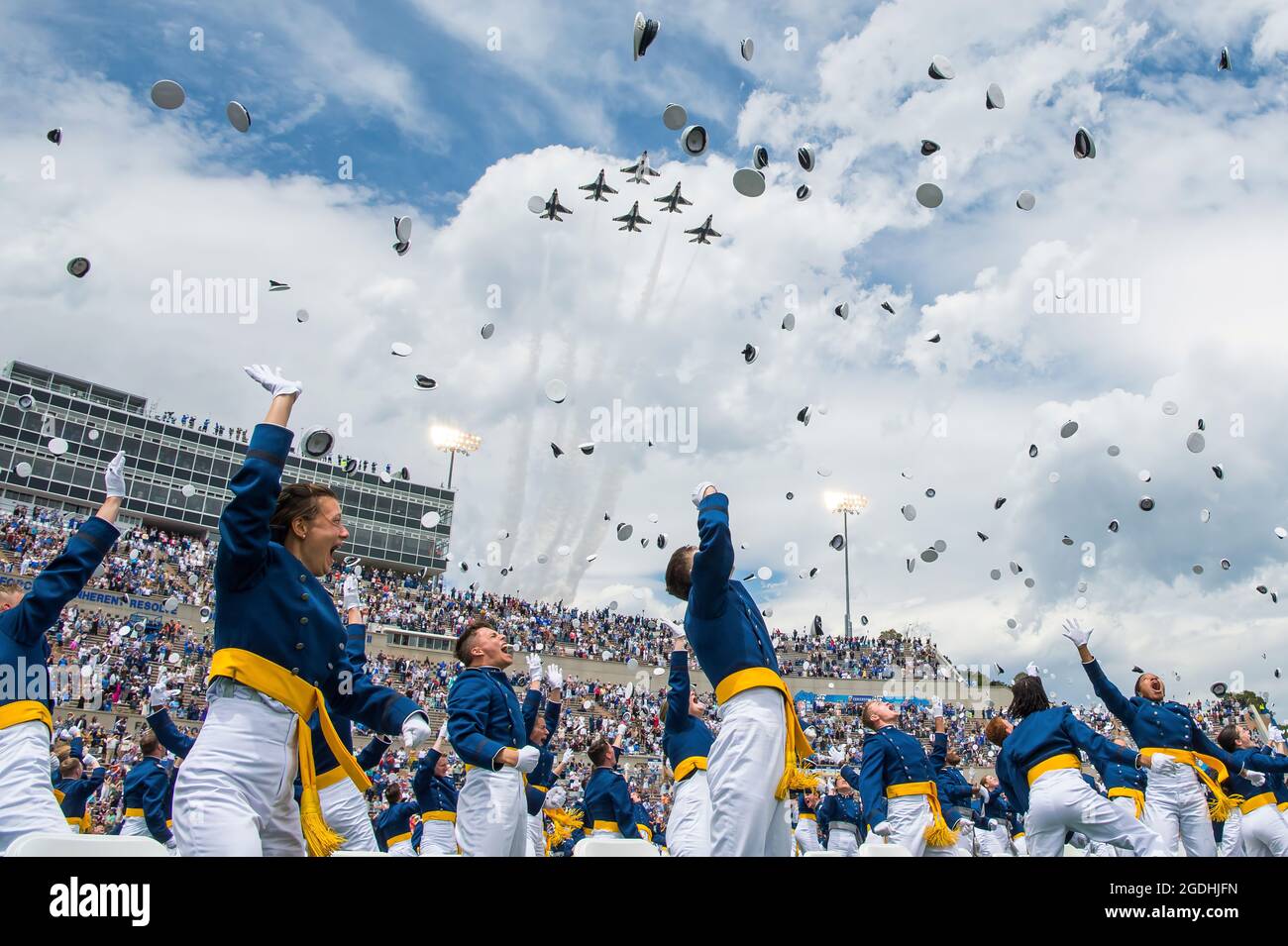 U.S. Air Force Academy Class of 2021 graduates toss their service caps as the U.S. Air Force Thunderbirds fly overhead during the Academy’s graduation ceremony in Colorado Springs, Colo., May 26, 2021. A total of 1,019 cadets crossed the stage to become the Air Force and Space Force’s newest second lieutenants. (U.S. Air Force photo by Trevor Cokley) Stock Photo